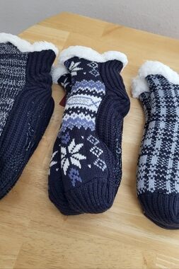 Three pairs of Women's Muk Luks socks in various  colors and patterns.